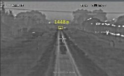 A thermal image of cars crossing the track 1448 meters ahead of the train