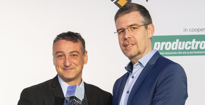 Frisimos CEO Tal Pechter (left), recieves the Innovation Award at Productronica 2023 in Munich, Germany